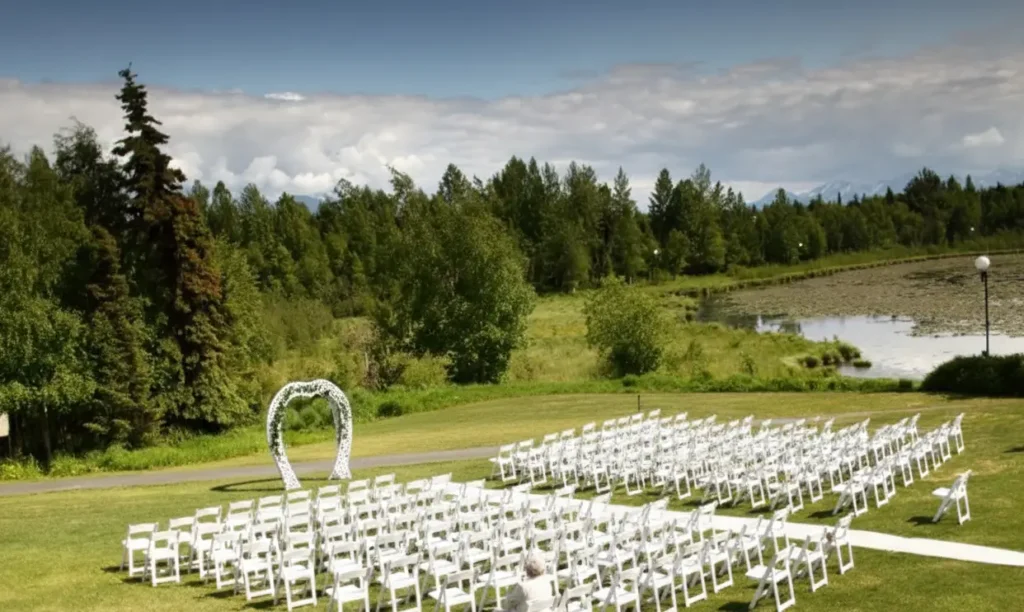 An outdoor wedding set up in the Bayshore Clubhouse green space in the summer